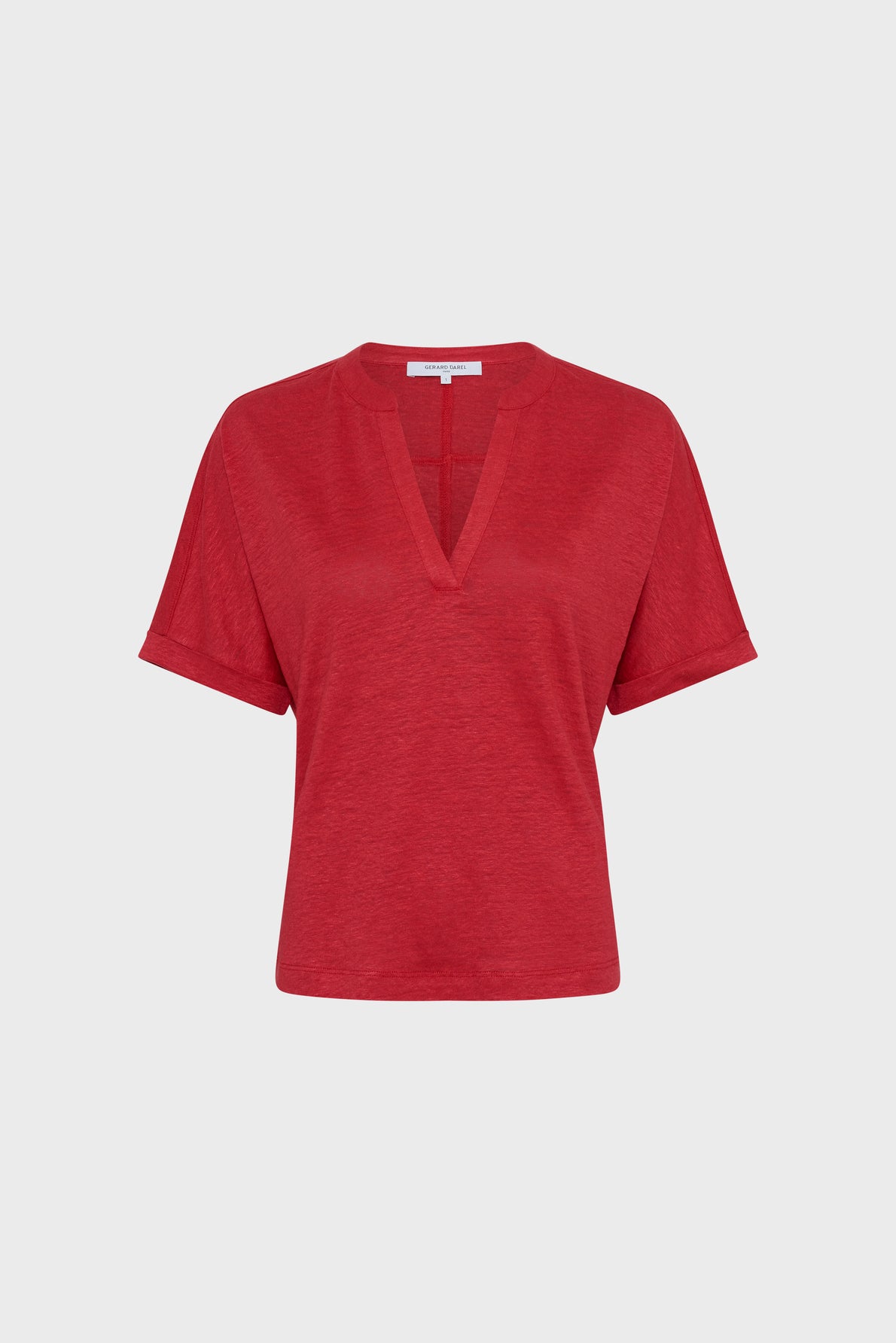 A short-sleeved, red V-neck t-shirt with a relaxed fit displayed against a plain white background.