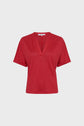 A short-sleeved, red V-neck t-shirt with a relaxed fit displayed against a plain white background.