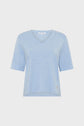 Light blue short-sleeved t-shirt en V displayed on a plain white background. The shirt has a relaxed fit, perfect to look casual, with a simple, minimalistic design and subtle stitching details.