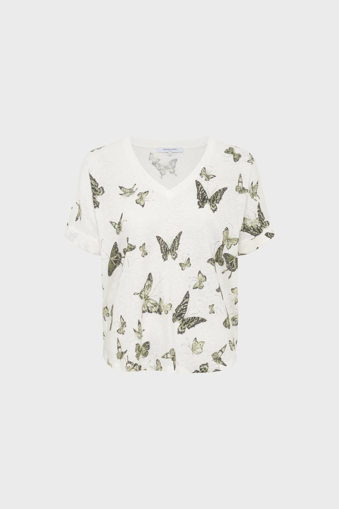 A white short-sleeve V-neck T-shirt featuring a pattern of green and black butterflies scattered across the front and sleeves.