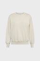 A plain, long-sleeved, crewneck sweatshirt in a light beige color, crafted from soft sweat coton for everyday comfort. This sweat décontracté is displayed against a white background.