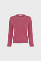 A long-sleeve, button-up pink gilet col rond crafted from lin mélangé, featuring a round neckline and displayed on a plain white background.