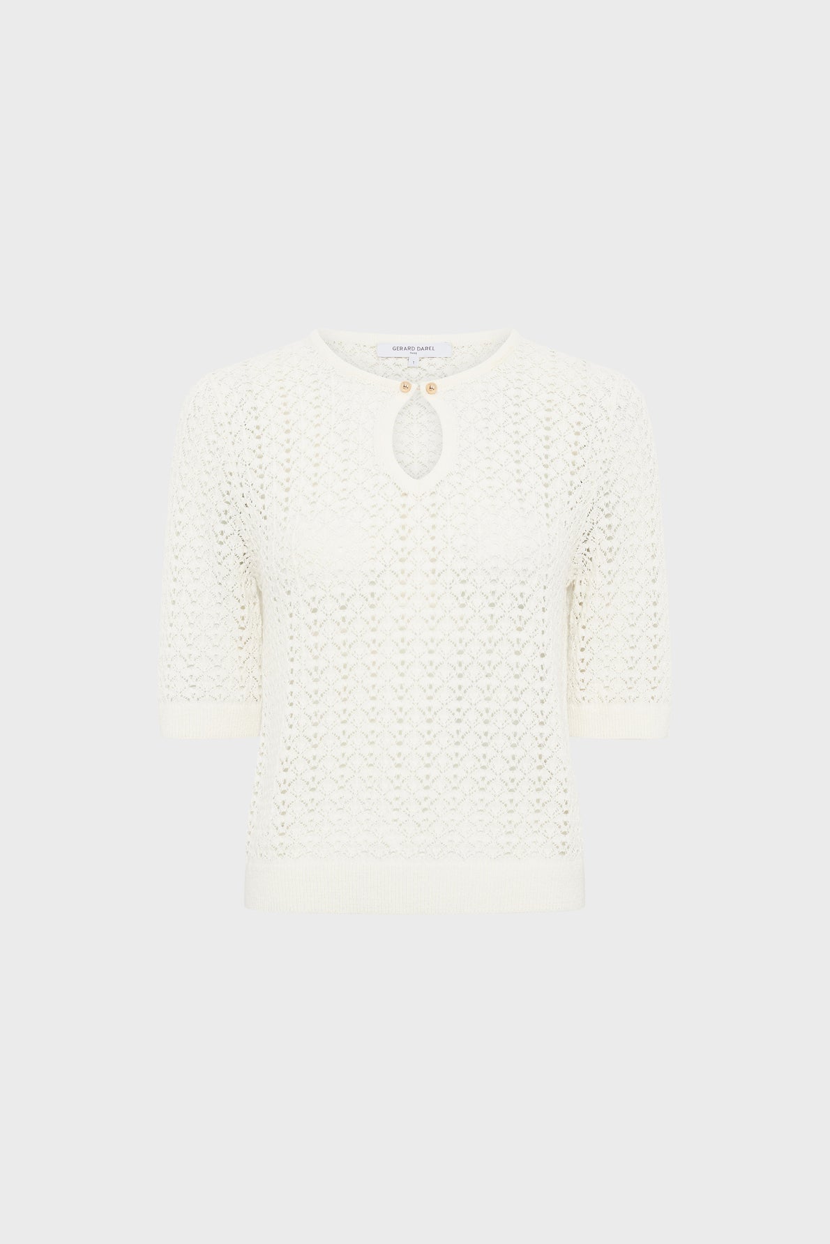White short-sleeve knit top with a round neckline, a small keyhole cut-out at the chest, ribbed cuffs and hem, and a textured pattern throughout. The background is plain light gray.