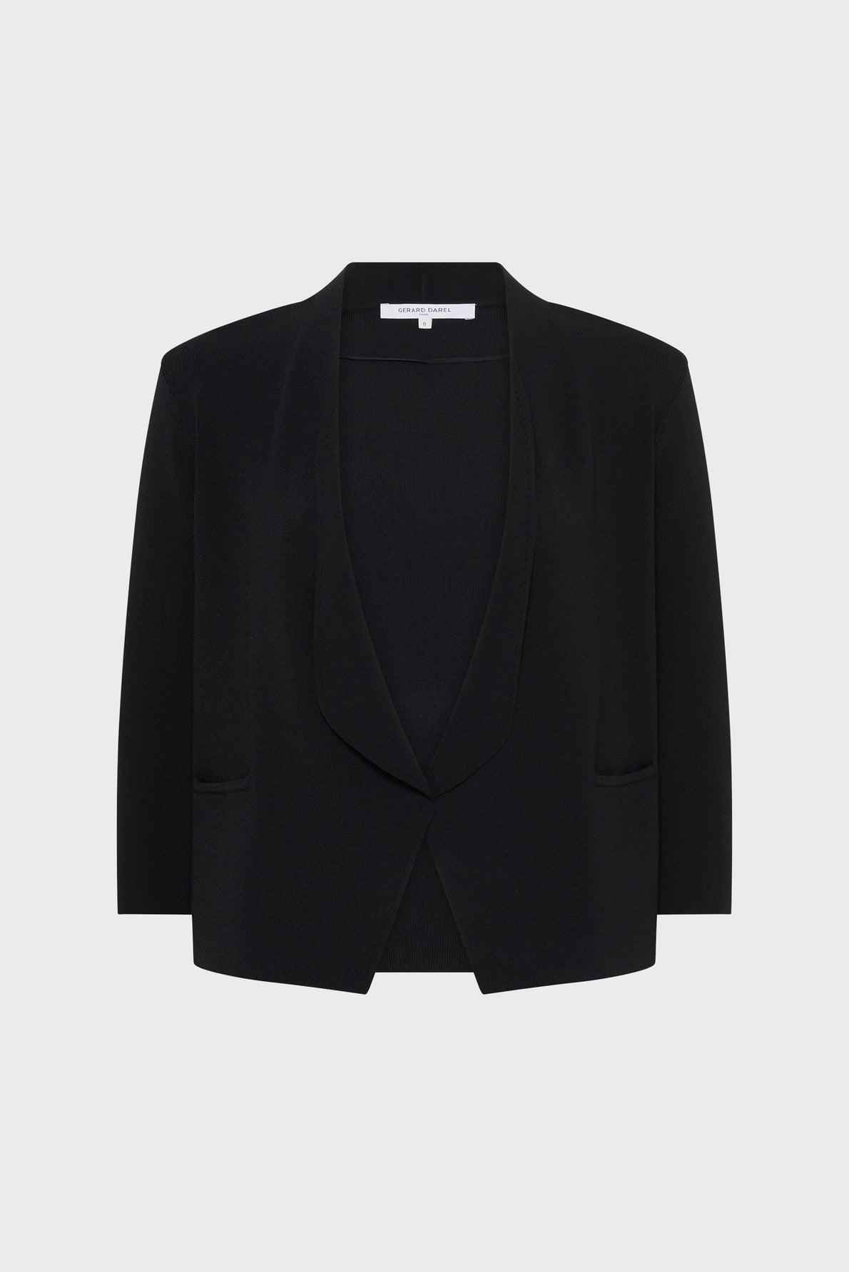 Black open-front blazer with a shawl collar, long sleeves, and two front pockets, displayed on a plain light grey background. This gilet femme chic offers an effortlessly sophisticated layer for any occasion.