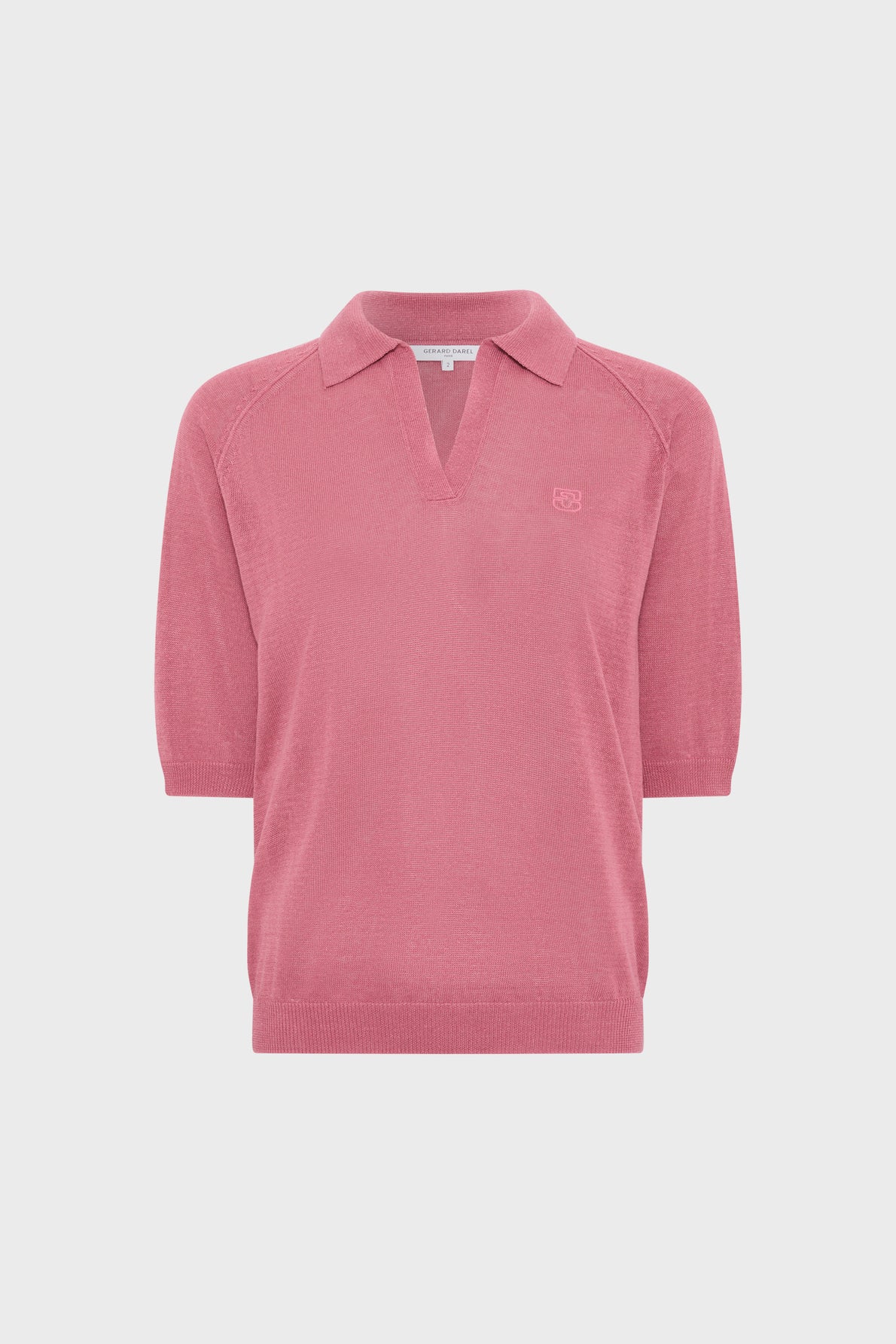 Pink short-sleeve knit pullover with a collar, V-neckline, and ribbed hems, displayed on a plain white background—a chic polo lin femme style that brings effortless elegance to your wardrobe.