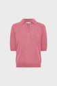 Pink short-sleeve knit pullover with a collar, V-neckline, and ribbed hems, displayed on a plain white background—a chic polo lin femme style that brings effortless elegance to your wardrobe.