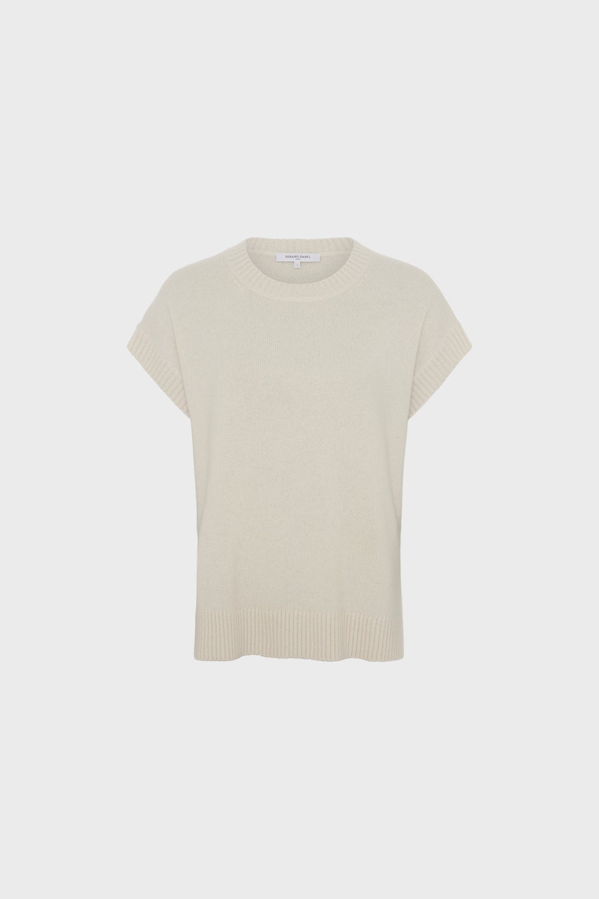 A short-sleeve, ivory knit sweater with a col rond and ribbed trim on the sleeves and hem, displayed against a plain white background, this pull cachemire femme offers timeless elegance.