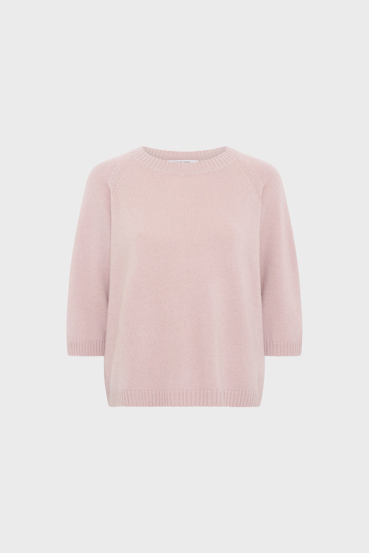 Light pink, short-sleeved knit pull femme in soft cachemire with a crew neckline and ribbed hem and cuffs, displayed against a plain white background.
