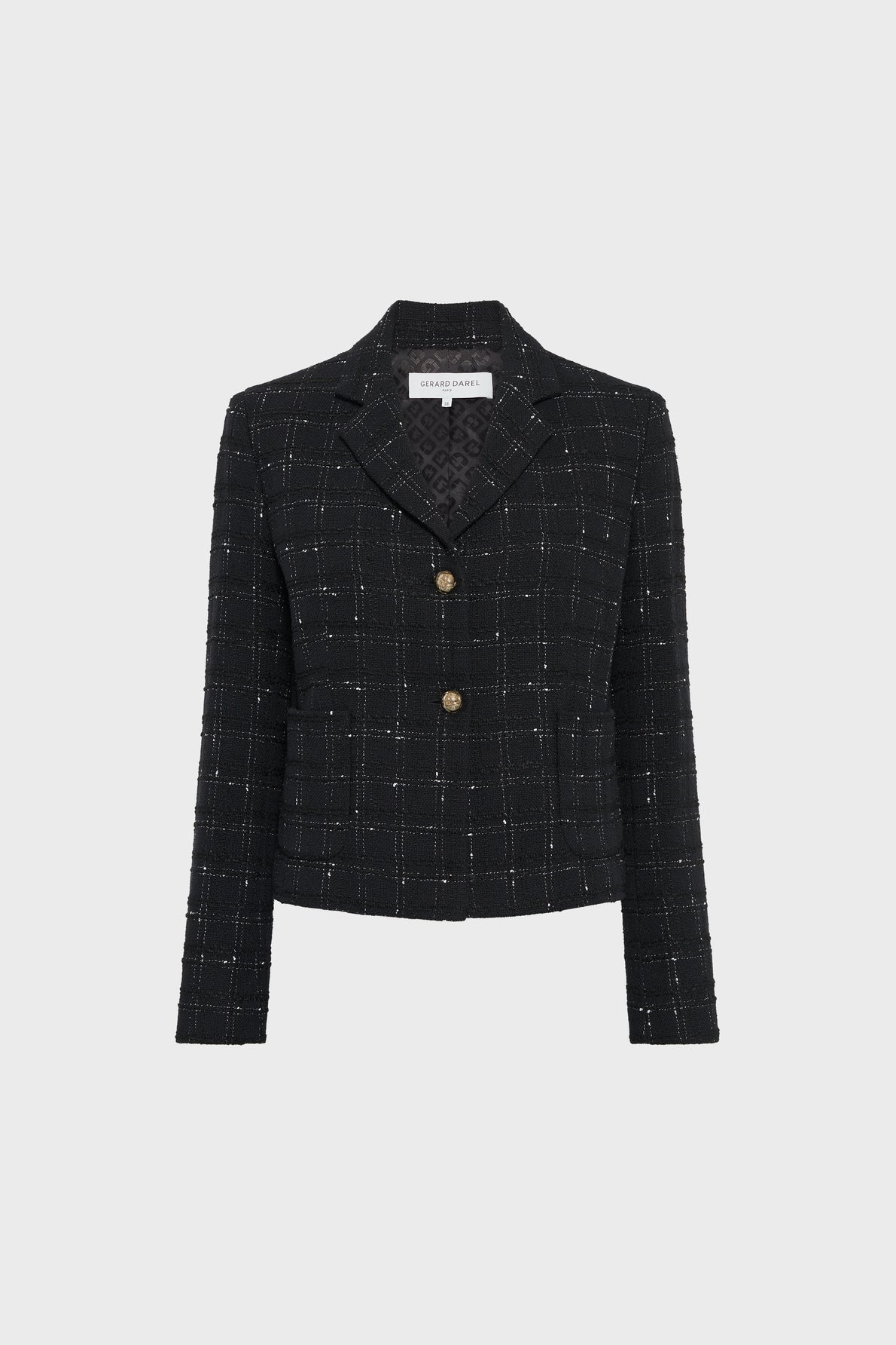 A black tweed blazer with a white grid pattern, two gold buttons, long sleeves, and a notched collar, this veste tailleur tweed is displayed on a plain light background. Perfect as a veste chic femme, it brings sophistication and elegance to any outfit.