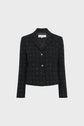 A black tweed blazer with a white grid pattern, two gold buttons, long sleeves, and a notched collar, this veste tailleur tweed is displayed on a plain light background. Perfect as a veste chic femme, it brings sophistication and elegance to any outfit.