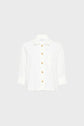 White long-sleeve button-up shirt with a collar, front pocket, and large gold buttons, displayed against a plain light gray background.