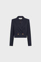 A navy blue, cropped double-breasted blazer with long sleeves and two gold buttons on the front, displayed on a plain light gray background.