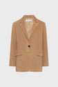A tan single-breasted blazer with a notched collar, one button closure, flap pockets, and long sleeves, displayed against a plain white background.