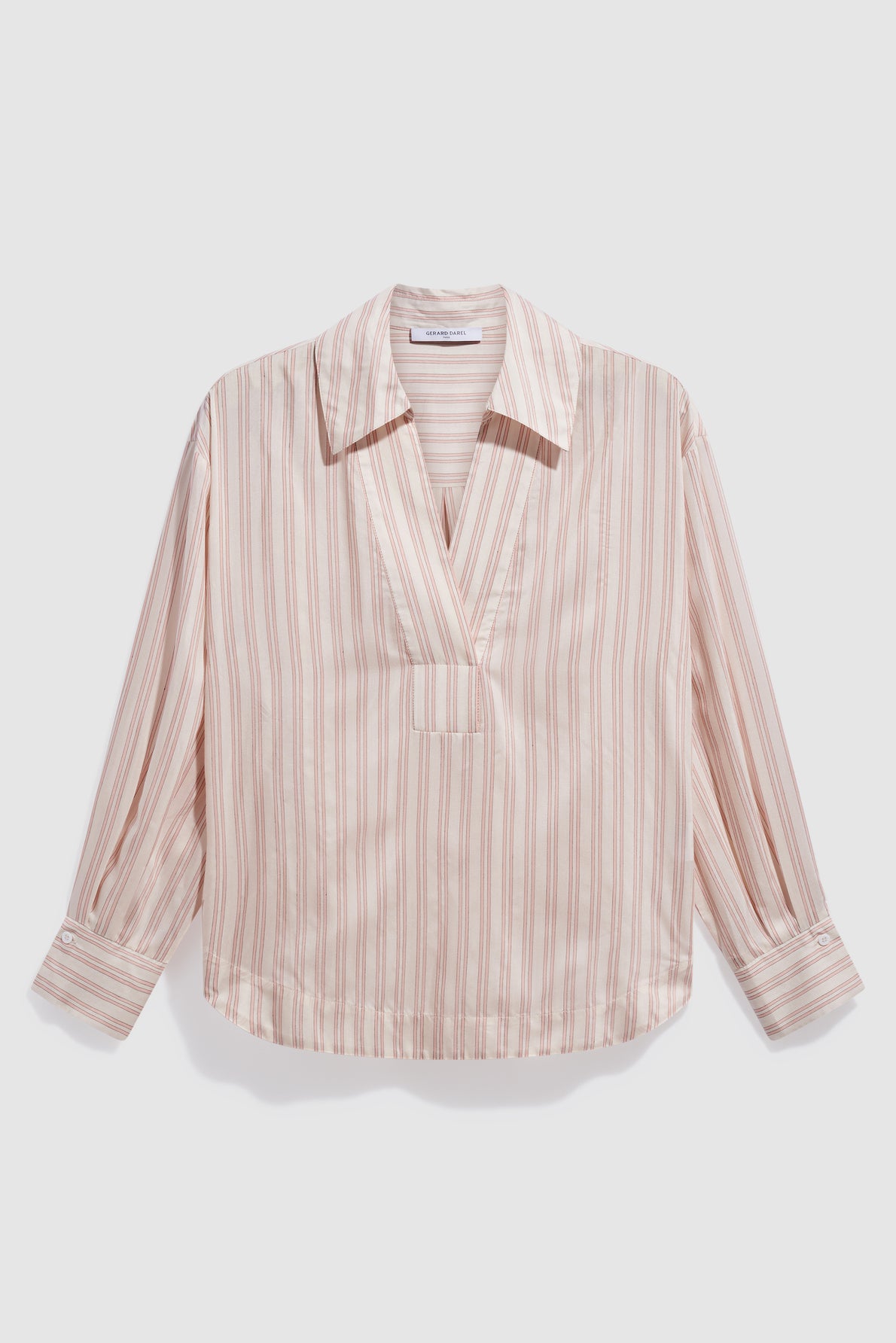 A light pink long-sleeve blouse rayée with vertical beige and brown stripes, a wide col chemise V-neck collar, and buttoned cuffs, laid flat against a white background.