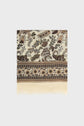 A cream-colored laine et soie écharpe florale with intricate brown, green, and tan floral and paisley patterns, and a fringed edge at the bottom, displayed flat on a neutral background.