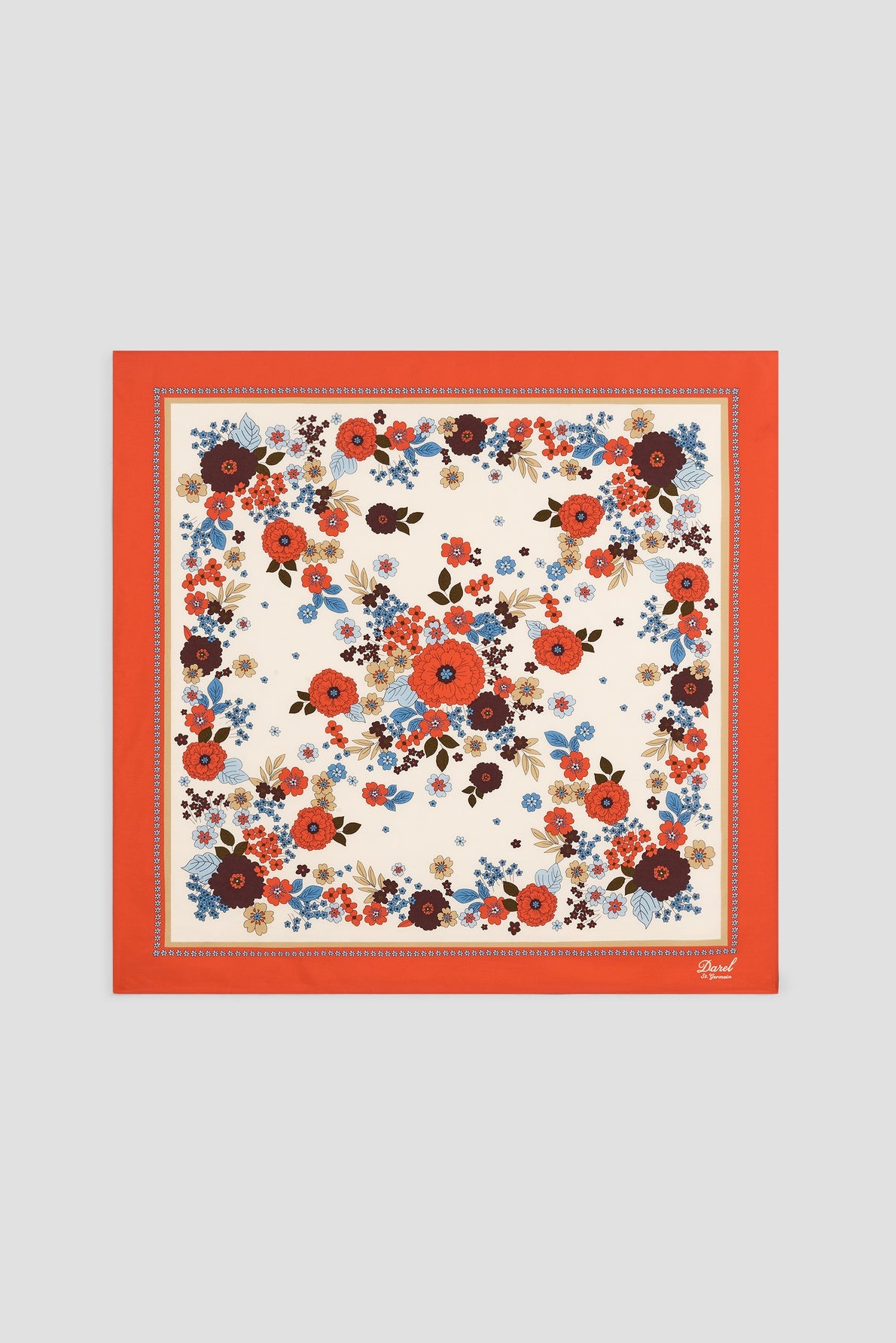 A square silk scarf in a carré rétro style with a red border, featuring a motif floral design of red, blue, and brown flowers and green leaves on a cream background—a timeless foulard femme accessory.