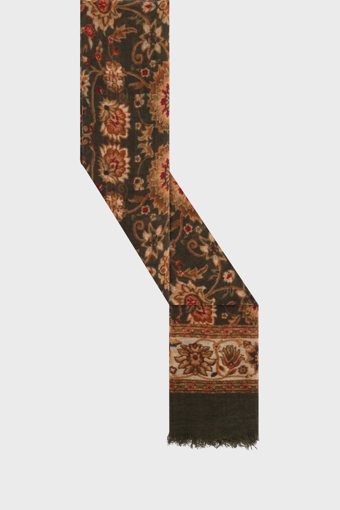 A dark green écharpe bohème with an ornate motif fleuri in red, gold, and beige tones, featuring a fringed edge at the bottom.