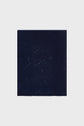 A folded bleu marine écharpe en laine with a subtle pattern of small, sparkling dots and delicate sequins arranged vertically, creating a gradient effect from top to bottom against a light background.