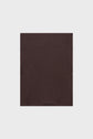 A plain, square piece of dark brown cachemire fabric, reminiscent of a luxurious écharpe, is centered on a light gray background.