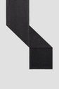 A charcoal gray wool scarf, or écharpe anthracite, is laid flat on a light background, with one end folded over the other at an angle, showing its rectangular shape and soft texture.