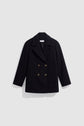 Black double-breasted peacoat crafted from fine laine vierge, featuring gold buttons, two front pockets, and a wide collar, displayed on a plain light gray background.