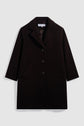 A black, knee-length manteau femme in laine angora with three buttons, two angled front pockets, and a notched lapel collar, displayed flat against a white background.