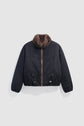 A black bomber jacket with a brown faux fur collar, front zipper, elastic cuffs, and adjustable waist, this parka courte is displayed on a plain light gray background.