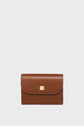 A brown leather wallet with a curved flap, gold clasp, and visible stitching, displayed against a plain white background—this petit portefeuille cuir is designed for elegance and practicality.