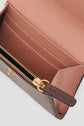 Open pink and brown leather wallet with gold zipper, card slots, and a pocket inside. This portefeuille super plat features a visible wallet lining and zipper pull, offering both elegance and practicality for everyday use.