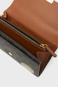 Open brown leather wallet with a gold zipper, button closure, and patterned exterior. This elegant portefeuille cuir features multiple compartments inside and a green circular sticker visible on the front pocket—perfect for any portefeuille femme seeking both style and functionality.