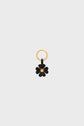 Gold keyring with a black flower-shaped charm en cuir and a gold center, displayed on a plain light gray background—an accessoire clé that adds a touch of bijou porte-bonheur to your everyday essentials.