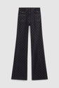 A pair of dark wash, taille haute, wide-leg jeans with front buttoned pockets and an all-over subtle geometric monogramme pattern, laid flat on a plain white background.