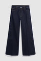 Dark blue wide-leg jeans with a high waist, front button and zipper closure, classic five-pocket design, and visible stitching, displayed flat on a plain light background. This modèle jean brut features a coupe large for a relaxed yet timeless silhouette.