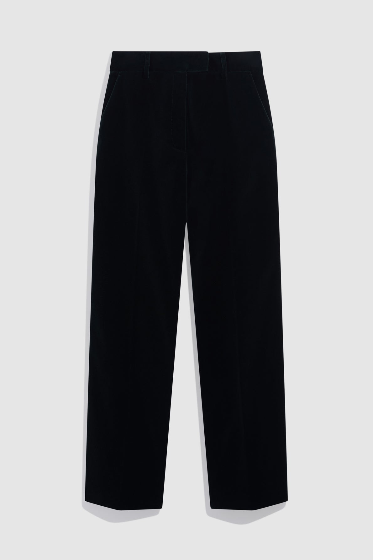 Black straight-leg trousers with side pockets, reminiscent of a classic pantalon tailleur velours, shown against a plain light gray background.