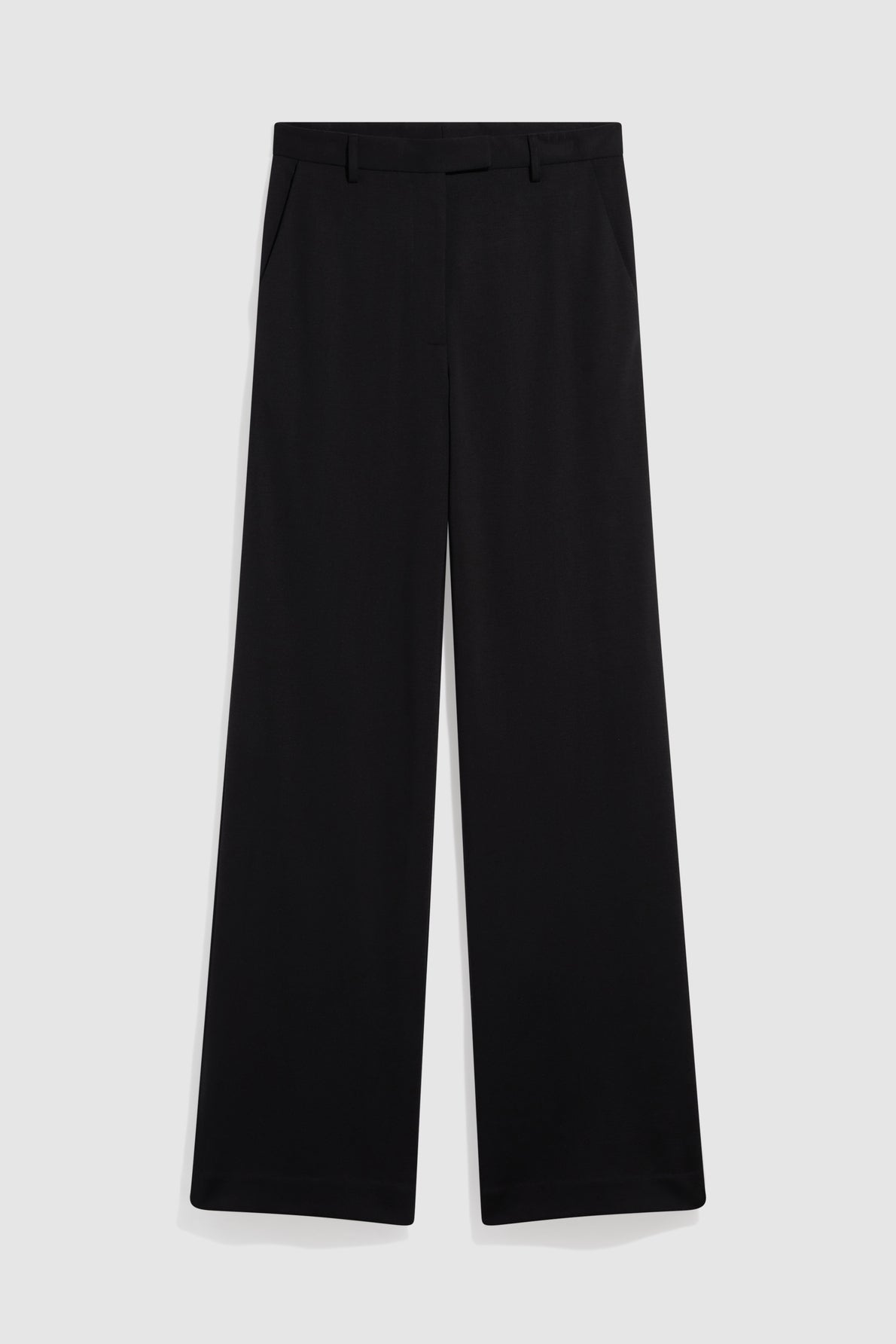 A pair of black, wide-leg pantalon tailleur dress pants with belt loops, front pockets, and a clean, tailored look, displayed flat against a light gray background.