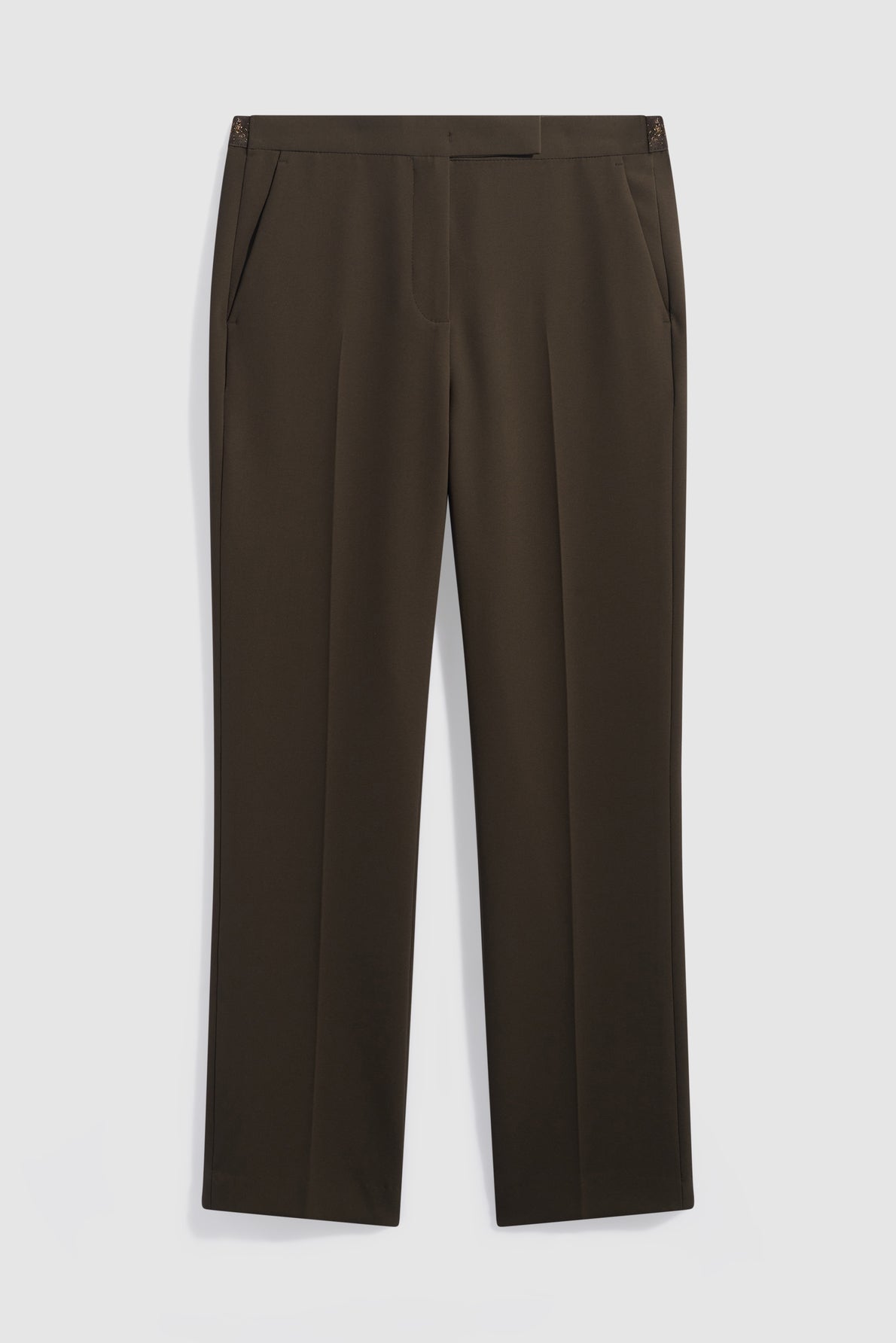A pair of dark brown, 7/8-length pantalon de tailleur dress pants with side pockets, pressed front creases, and a flat waistband, displayed against a plain white background.