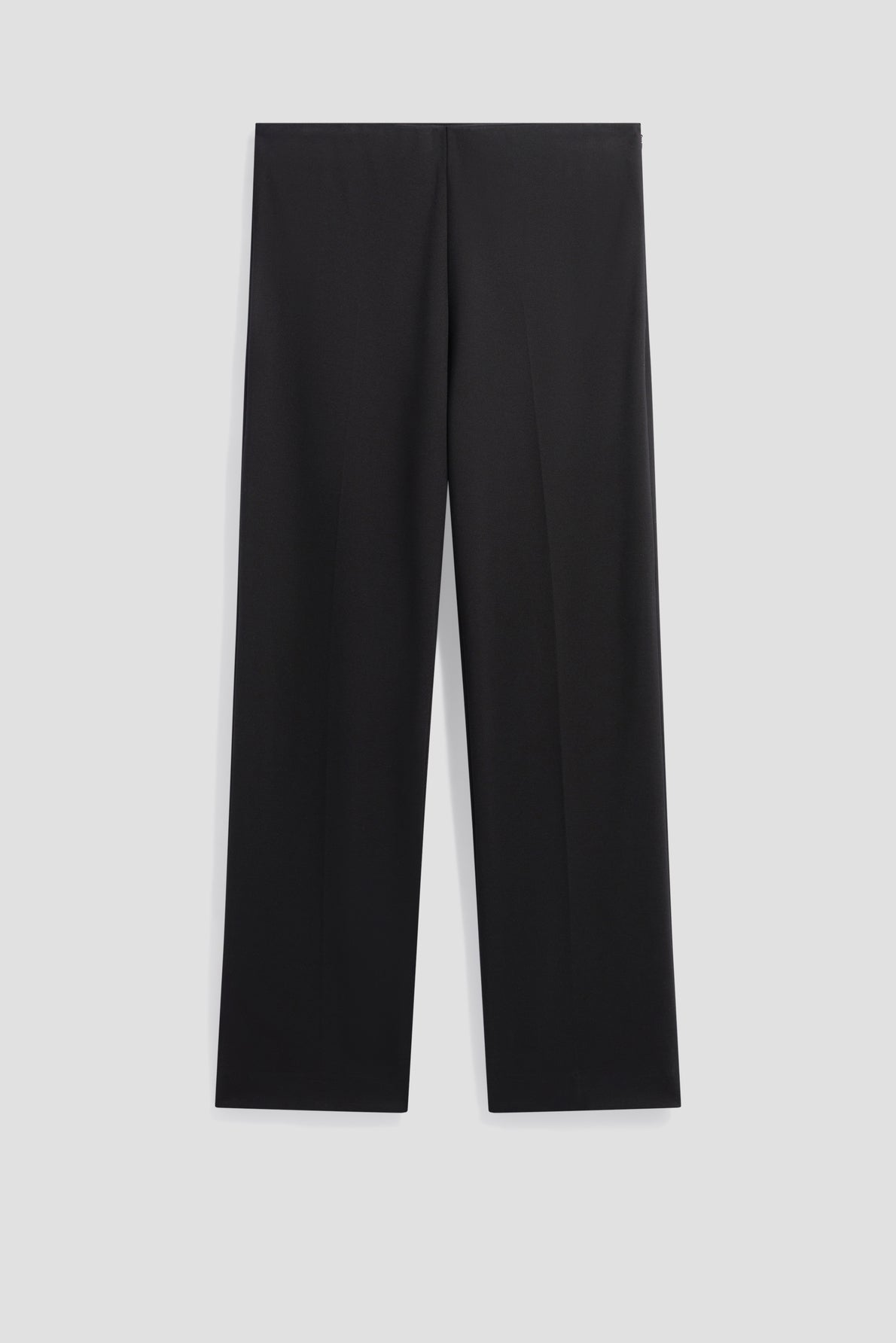 Wide-leg black dress pants, or pantalon noir, are neatly displayed against a plain light gray background, showing the front view with a simple, minimal design and no visible pockets or embellishments.