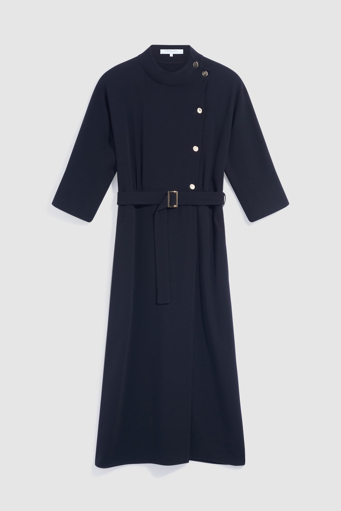 Navy blue crêpe uni midi dress with a col montant, elbow-length sleeves, side buttons on the shoulder and chest, and a belted waist. The robe midi is displayed on a plain white background.