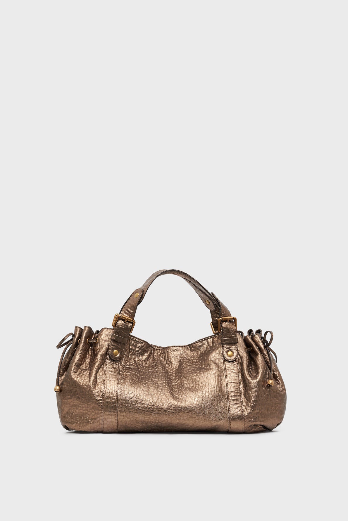 Metallic bronze sac à main with short handles and gathered side details, placed against a plain light gray background.