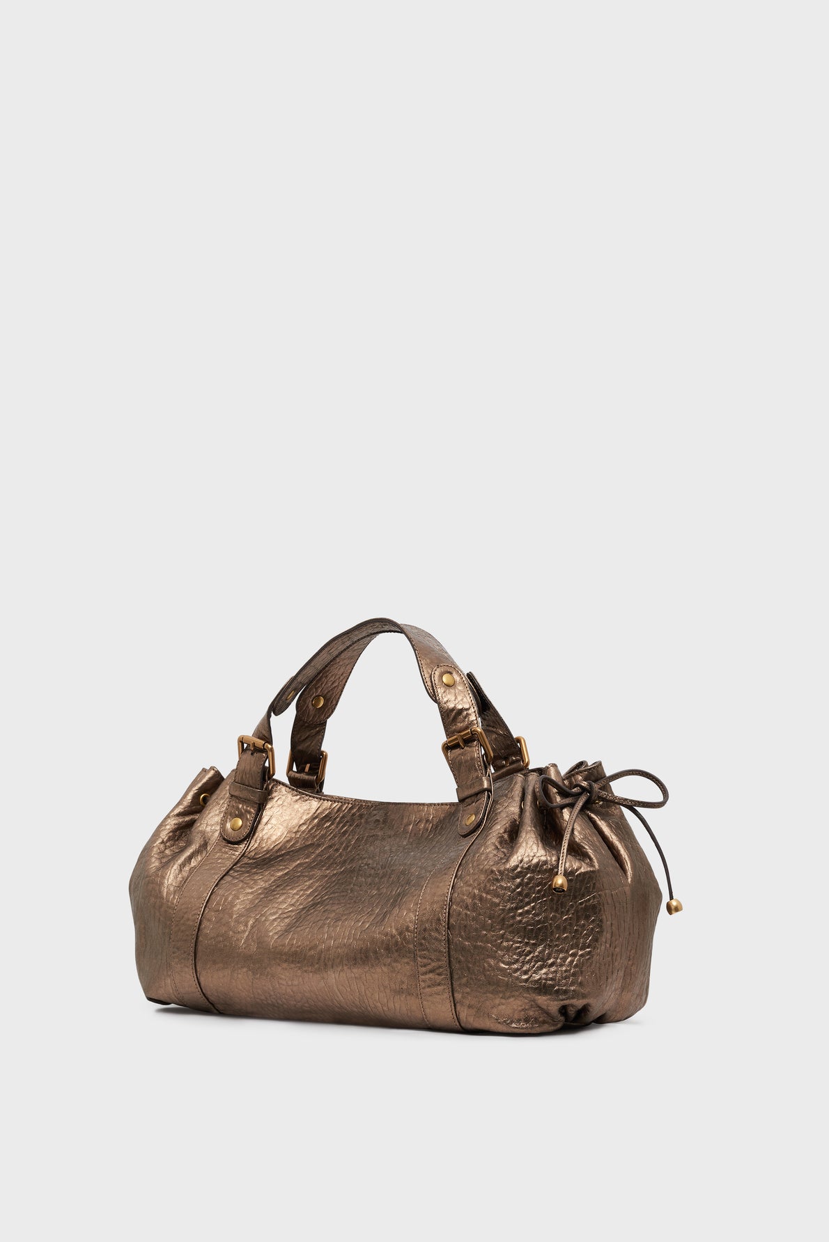 A metallic bronze sac à main crafted in cuir bubble métallisé, featuring dual handles, gold hardware, and side drawstring details, is elegantly displayed on a plain light background.