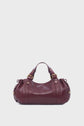 A burgundy sac à main in cuir de vachette froissé with gold hardware, double handles, and slight ruching on the sides, set against a plain white background.