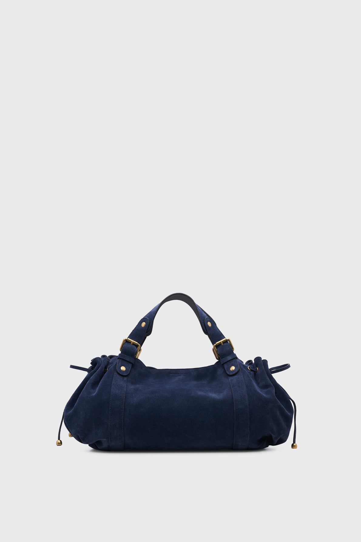 A navy blue cuir velours sac à main with gold hardware, two short handles, and drawstring detailing on the sides, set against a plain light gray background.