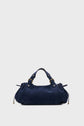 A navy blue cuir velours sac à main with gold hardware, two short handles, and drawstring detailing on the sides, set against a plain light gray background.