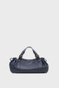 A navy blue sac à main cuir with gold hardware, short handles, and gathered side details, this elegant piece of maroquinerie Darel is displayed against a plain light gray background.