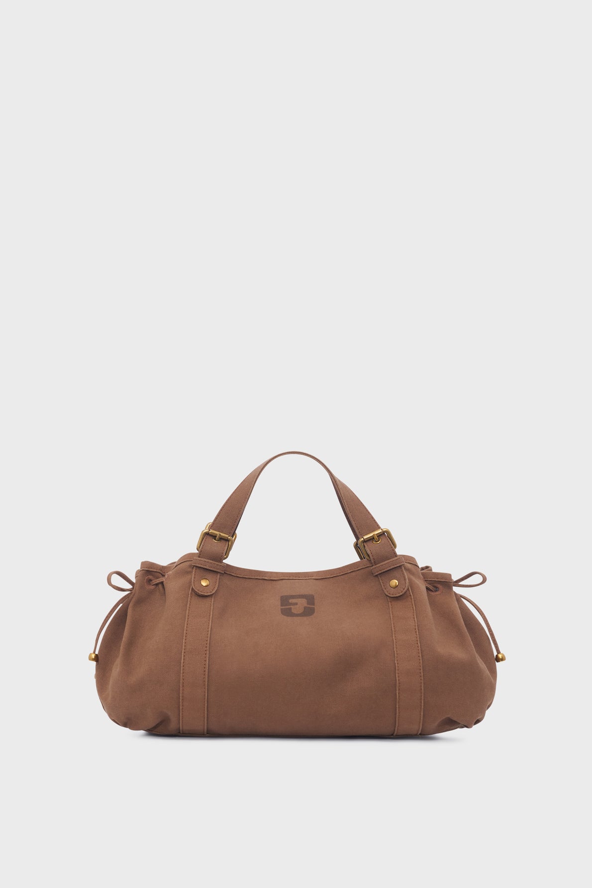 Brown suede sac à main with double handles, gold-tone hardware, and side drawstring details, featuring a subtle nod to toile bicolore design elements, displayed against a plain white background.