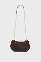 A small, dark brown cuir velours tressé textured handbag with a long gold chain strap and gold hardware details, this elegant sac bandoulière is displayed against a plain white background.