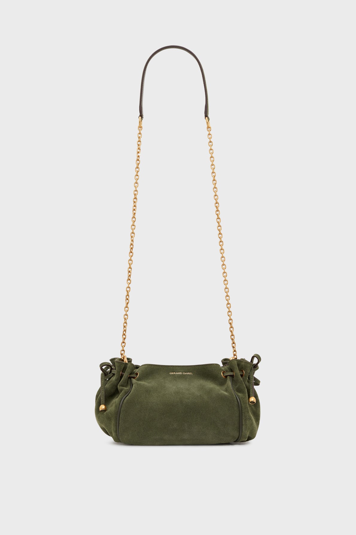 Olive green cuir velours suede handbag with gold chain shoulder strap, small side bows, and gold hardware, set against a plain light background—this elegant sac 24H mini sac bandoulière is the perfect touch of sophistication for any outfit.
