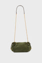 A small olive green sac bandoulière in cuir velours suede with a gold chain shoulder strap, gathered sides, and gold accents on the drawstring ends, set against a plain white background.