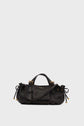 A black sac à main in cuir bubble with gold hardware, short handles, and adjustable side ties, displayed against a plain light grey background.