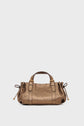 A small metallic bronze sac à main in cuir mouton bubble with a textured surface, two short handles, side drawstring details, and gold hardware, placed against a plain white background.